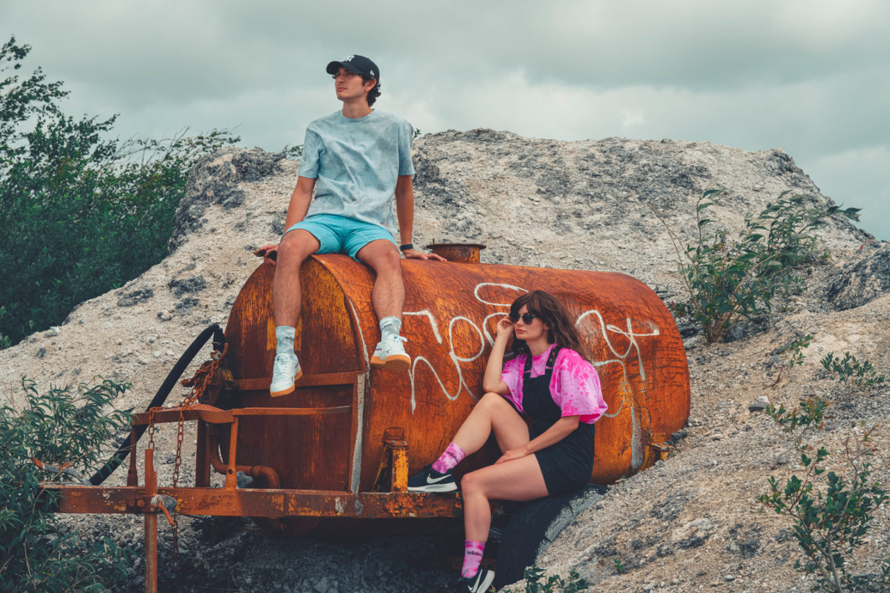 Hipsters in quarry wearing tie dye clothing